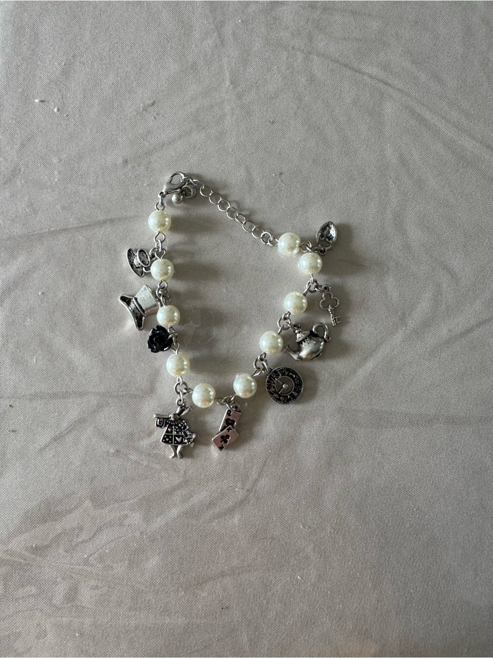 Alice in wonderland themed charm bracelet from hot topic- like new